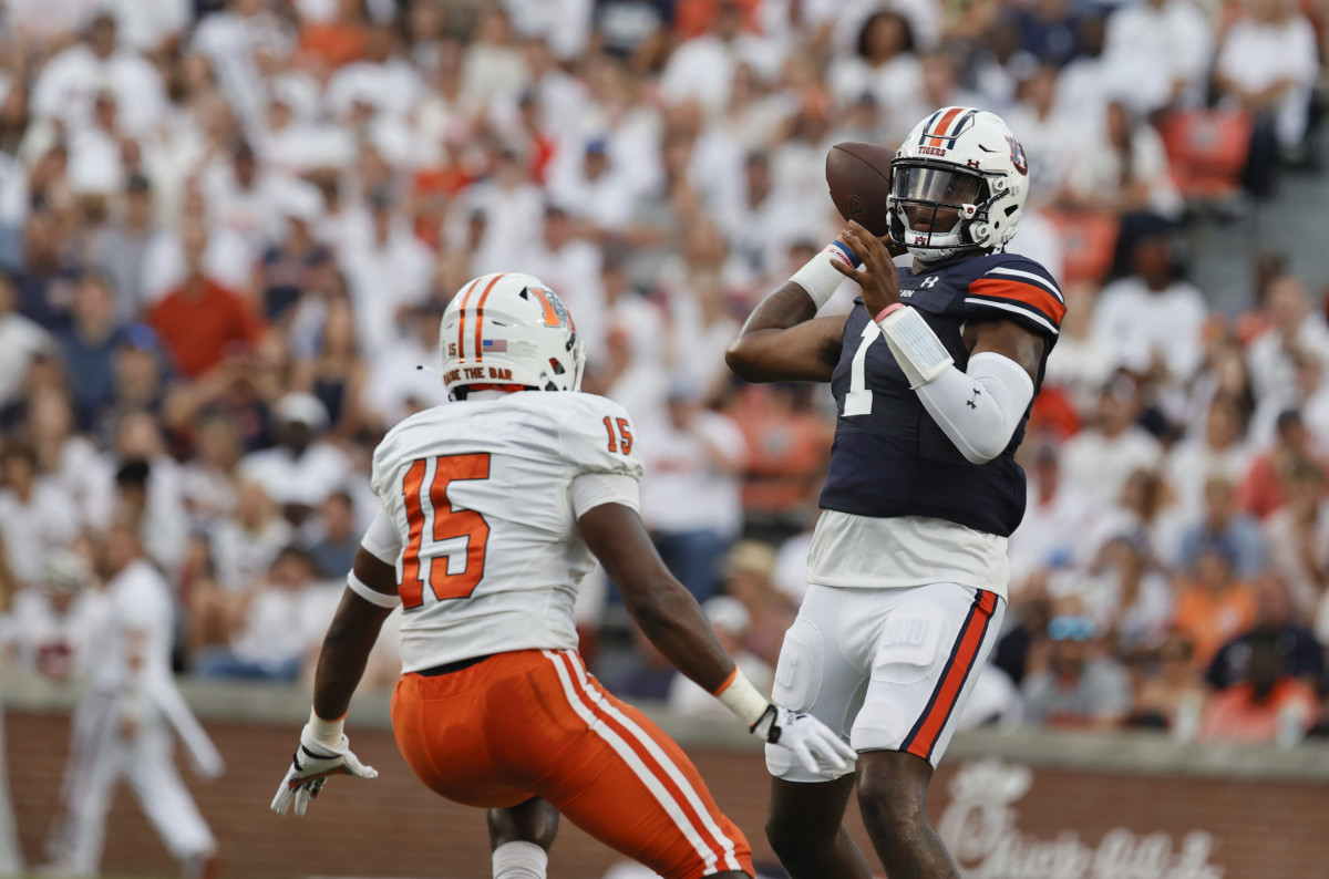 Sep 3, 2022; Auburn, Alabama, USA; Auburn Tigers quarterback T.J. Finley (1) drops back to pass as Mercer Bears linebacker Ken Standley (15) closes in during the first quarter at Jordan-Hare Stadium. Mandatory Credit: John Reed-USA TODAY Sports